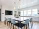 Bright kitchen featuring a large island with seating, modern appliances and plenty of natural light at 40 Wabash St, Pittsboro, NC 27312