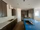 Bright kitchen featuring wood cabinets, quartz countertops, and a tile backsplash at 40 Wabash St, Pittsboro, NC 27312