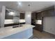 Modern kitchen with a center island, stylish pendant lighting, and sleek cabinetry at 40 Wabash St, Pittsboro, NC 27312