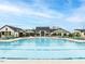 Community pool with chairs and umbrellas, surrounded by clubhouse buildings at 40 Wabash St, Pittsboro, NC 27312