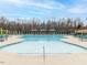 Beautiful pool area with comfortable lounge chairs, umbrellas, and a serene outdoor setting at 40 Wabash St, Pittsboro, NC 27312