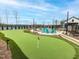 Well-maintained putting green with nearby seating, ideal for leisure and recreation at 40 Wabash St, Pittsboro, NC 27312
