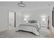 Well-lit bedroom with modern decor, and a glimpse into the ensuite bathroom at 401 Brinkman Ct, Raleigh, NC 27614