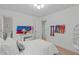 Inviting bedroom with plush bedding, hardwood floors, and ample natural light at 401 Brinkman Ct, Raleigh, NC 27614