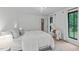 Bright bedroom featuring hardwood floors and a decorative horse accent at 401 Brinkman Ct, Raleigh, NC 27614