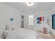 Cozy bedroom features plush bedding, two windows, and stylish decor at 401 Brinkman Ct, Raleigh, NC 27614