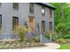 Elegant home featuring a stylish entrance with a detailed doorway and manicured landscaping at 401 Brinkman Ct, Raleigh, NC 27614