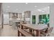 Open-concept kitchen with a large island, custom cabinetry, and a seamless flow to the living area at 401 Brinkman Ct, Raleigh, NC 27614