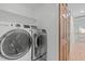 Functional laundry room equipped with modern washer and dryer units at 401 Brinkman Ct, Raleigh, NC 27614