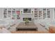 Spacious living area with built-in shelving, a modern fireplace, and neutral decor at 401 Brinkman Ct, Raleigh, NC 27614
