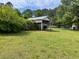 Exterior view of a carport with a boat sheltered, providing convenient covered parking at 407 N Cheatham St, Franklinton, NC 27525
