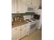 Kitchen showcasing white cabinetry and standard appliances at 407 N Cheatham St, Franklinton, NC 27525