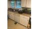 Functional kitchen features essential appliances and window views at 407 N Cheatham St, Franklinton, NC 27525