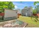 Spacious backyard features a garden area, a shed, and a well-maintained lawn at 4125 Palafox Ct, Raleigh, NC 27604