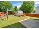 Backyard features a shed with a deck, a fenced yard, and a small brick patio at 4125 Palafox Ct, Raleigh, NC 27604