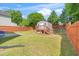 Large, fenced backyard with a storage shed and plenty of green space at 4125 Palafox Ct, Raleigh, NC 27604
