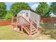 Backyard featuring a shed with a small deck and stairs at 4125 Palafox Ct, Raleigh, NC 27604