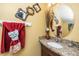 Stylish bathroom with granite countertop, decorative mirror, and decorative accents at 4125 Palafox Ct, Raleigh, NC 27604