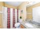 Functional bathroom with a granite countertop vanity, toilet, and shower with curtain at 4125 Palafox Ct, Raleigh, NC 27604