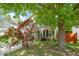 Inviting two-story home with a well-maintained lawn and beautiful mature trees in the front yard at 4125 Palafox Ct, Raleigh, NC 27604