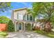 Charming two-story home featuring a welcoming front porch with classic columns and green shutters at 4125 Palafox Ct, Raleigh, NC 27604