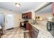 Well-lit kitchen featuring granite countertops, stainless steel appliances, and decorative tile flooring at 4125 Palafox Ct, Raleigh, NC 27604
