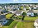 Aerial view of neighborhood homes with fenced yards and landscaped gardens at 4333 Benton Mill Dr, Fuquay Varina, NC 27526