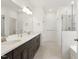 Bathroom features dual sinks, granite countertops, a large mirror, and glass enclosed shower at 4333 Benton Mill Dr, Fuquay Varina, NC 27526
