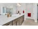 Bathroom with double vanity, decorative light fixture, framed mirror, and glass enclosed shower at 4333 Benton Mill Dr, Fuquay Varina, NC 27526