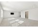Bright bonus room with television, carpet, and multiple windows at 4333 Benton Mill Dr, Fuquay Varina, NC 27526
