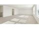 Bright bonus room with multiple windows and carpet at 4333 Benton Mill Dr, Fuquay Varina, NC 27526