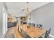 Open concept dining room with chandelier, and views into living room and kitchen at 4333 Benton Mill Dr, Fuquay Varina, NC 27526