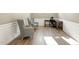 Home office featuring wainscotting, hardwood floors, and two armchairs at 4333 Benton Mill Dr, Fuquay Varina, NC 27526