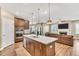 Open kitchen features a large island and stainless steel appliances perfect for entertaining at 4333 Benton Mill Dr, Fuquay Varina, NC 27526