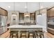 Spacious kitchen with stainless appliances, a large island with bar stool seating, and ample lighting at 4333 Benton Mill Dr, Fuquay Varina, NC 27526