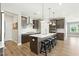Spacious kitchen with stainless appliances, gray cabinets, a large island with seating, and pendant lighting at 4333 Benton Mill Dr, Fuquay Varina, NC 27526