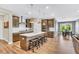 Spacious kitchen with stainless appliances, a large island with bar stool seating, and ample lighting at 4333 Benton Mill Dr, Fuquay Varina, NC 27526