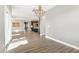 Open concept living space with wood flooring, modern chandelier, and kitchen with bar seating at 4333 Benton Mill Dr, Fuquay Varina, NC 27526