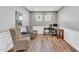 Home office space with hardwood floors, decorative wainscoting, and two chairs for seating at 4333 Benton Mill Dr, Fuquay Varina, NC 27526