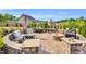Outdoor patio with custom stone work, ample seating, fire pit, and outdoor kitchen at 4333 Benton Mill Dr, Fuquay Varina, NC 27526