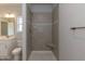 This bathroom features a tiled shower with a built-in seat and a modern vanity with a sink at 44 Cooper Branch Ct, Fuquay Varina, NC 27526