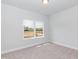 This bedroom offers lots of natural light, a spacious closet and neutral carpet flooring at 44 Cooper Branch Ct, Fuquay Varina, NC 27526