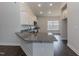 Stylish kitchen featuring granite countertops, white cabinets, and stainless steel appliances at 44 Cooper Branch Ct, Fuquay Varina, NC 27526