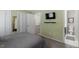 Cozy bedroom with attached bathroom and TV at 4617 Fawnbrook Cir, Raleigh, NC 27612