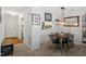 Cozy dining room featuring an stylish light fixture, modern table set and convenient open access to the kitchen at 4617 Fawnbrook Cir, Raleigh, NC 27612