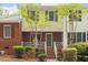 Charming townhouse featuring brick and siding exterior with well-maintained landscaping and inviting entryway at 4617 Fawnbrook Cir, Raleigh, NC 27612