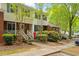 Charming brick townhome boasts curb appeal with manicured landscaping and inviting entrance at 4617 Fawnbrook Cir, Raleigh, NC 27612