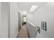 Upstairs hallway with access to bedrooms and a view to the exterior at 4617 Fawnbrook Cir, Raleigh, NC 27612
