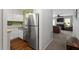 Modern kitchen with stainless steel appliances, white cabinets, and convenient layout open to the living area at 4617 Fawnbrook Cir, Raleigh, NC 27612