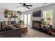Cozy living room featuring fireplace, plush seating, and abundant natural light, creating an inviting atmosphere at 4617 Fawnbrook Cir, Raleigh, NC 27612